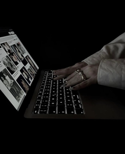 Hands typing on a laptop keyboard with digital marketing visuals on screen – Best Freelance Digital Marketing Consultant in Malappuram